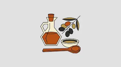 A glass carafe and a small bowl filled with oil, accompanied by an olive branch and a wooden spoon.