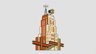 A tiered orange and cream building with a radio antenna and spotlight on top, with steel beams at the base.