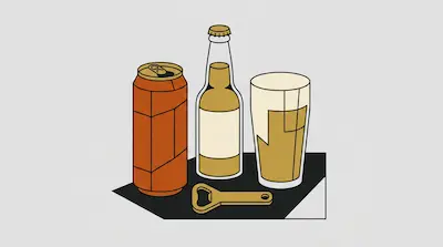 An orange can, a glass bottle, a glass of beer, and a bottle opener are arranged on a dark surface.