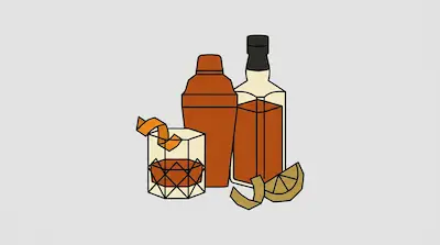 A cocktail in a faceted glass with an orange twist, a cocktail shaker, a bottle of liquor, and a lemon wedge.