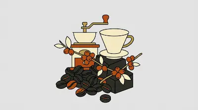 A manual coffee grinder and a coffee cup sit behind a pile of roasted beans and a coffee plant branch with berries.
