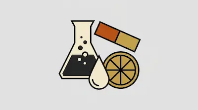 A laboratory flask with bubbles, a two-toned rectangular block, a droplet, and a citrus slice.