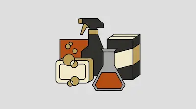 A spray bottle, a bar of soap with bubbles, a box, and a flask containing orange liquid.