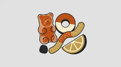A collection of stylized gummy candies including a gummy bear, a ring, a worm, and a citrus slice.