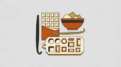 A chocolate bar, a bowl of sugar, vanilla beans, and a chocolate mold are grouped together.