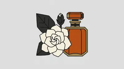 An amber perfume bottle stands next to a white flower with dark leaves.