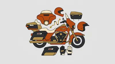 A stylized orange and tan touring motorcycle surrounded by riding gear, including helmets, gloves, and luggage.