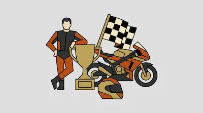 A racer in an orange and black suit stands next to a trophy, a checkered flag, a sport motorcycle, and a helmet.
