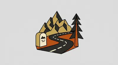 A winding road leads toward a mountain range with a single pine tree and a roadside marker.