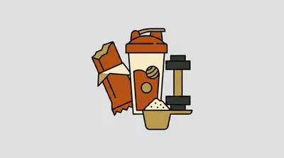 A wrapped protein bar, a shaker bottle, a dumbbell, and a scoop of powder grouped together.