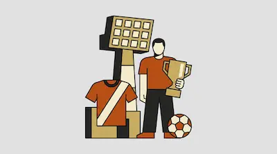 A person in an orange shirt holds a trophy next to a soccer ball, a jersey, and a stadium light tower.