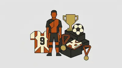 A soccer player stands next to a trophy, a soccer ball, medals, and jerseys in orange and black.