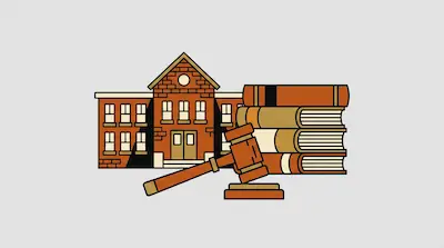 A brick building with a gabled roof stands behind a stack of four books and a wooden gavel.