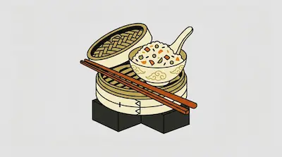 A bowl of fried rice with a spoon sits on a bamboo steamer basket, with a pair of chopsticks resting across it.