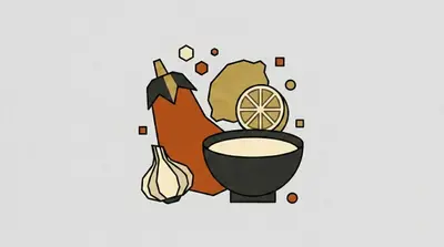 A large oblong vegetable with a dark cap, a garlic bulb, a halved citrus fruit, and a dark bowl filled with pale paste.